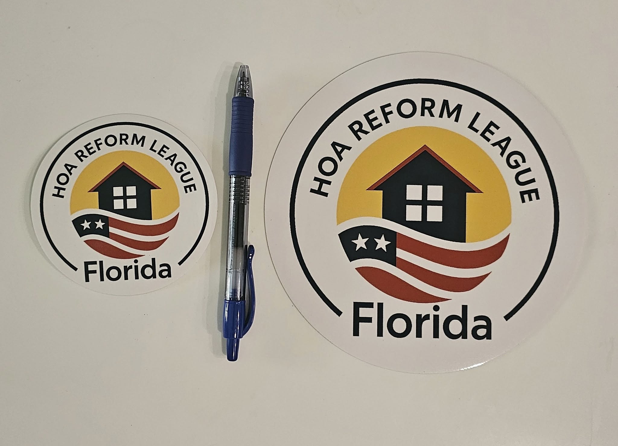 Size reference 3.5" beside 6" sticker with pen for scale reference